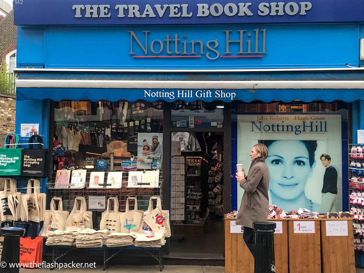 man walking past shop called notting hill