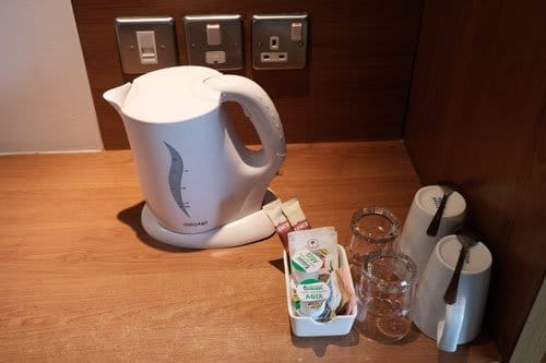 kettle mugs and tea and coffee sachets