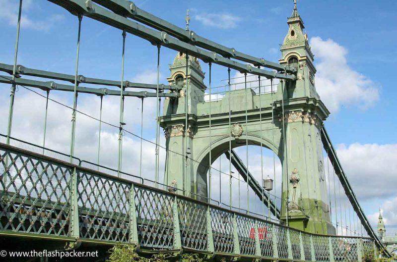 green iron bridge over river