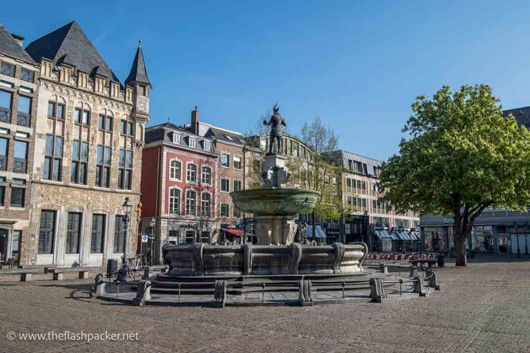 large cobblestoned market square with fountain in centre