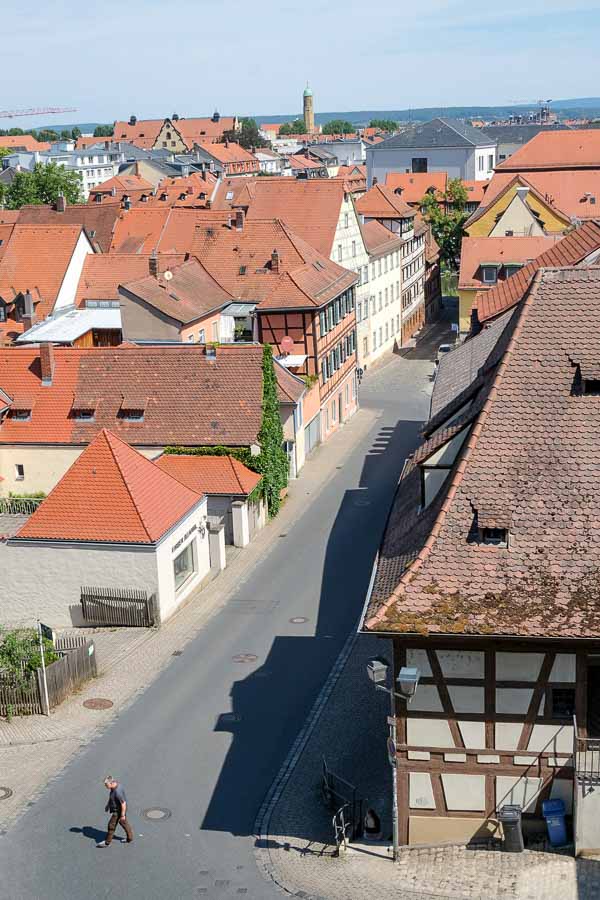 aerial view of old town of bamberg with man walking across street