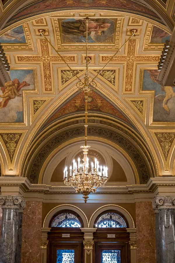 ornate interior of the opera house in budapest hungary with gilded ceiling and chandelier