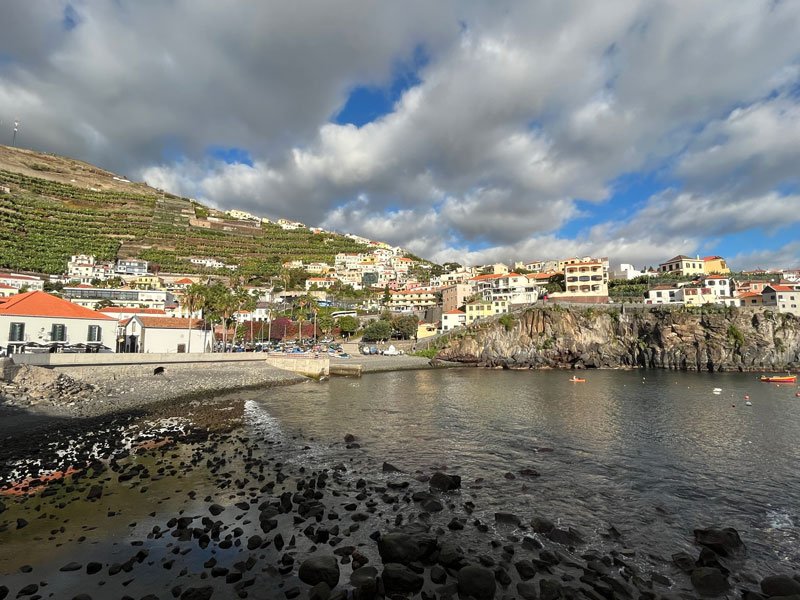 attractive harbour backed by terraced slopes studded with whitewashed houses