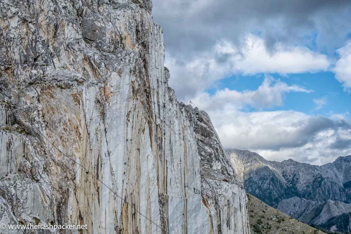 mountain face of white Carrara marble in mountain landscape