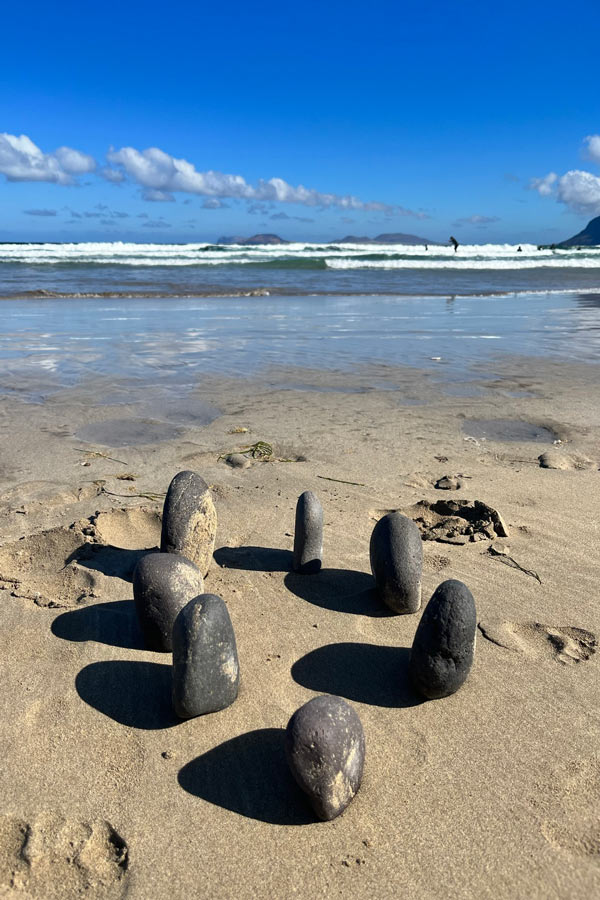 arrangement of pebbels on a sandy beach