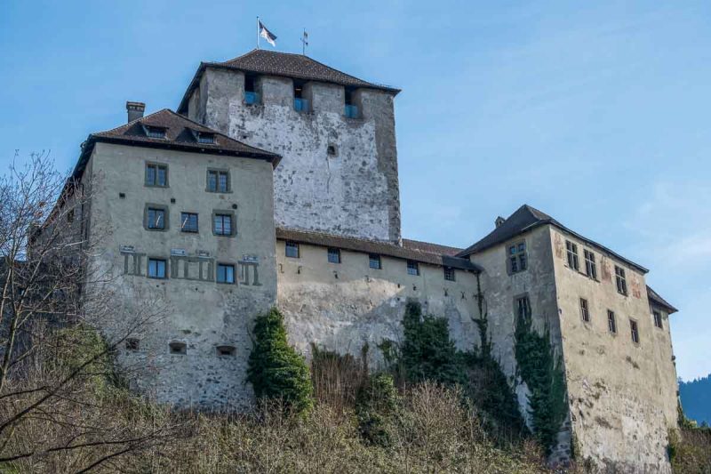 exterior of feldkirch schattenberg castle with towers and flag flying