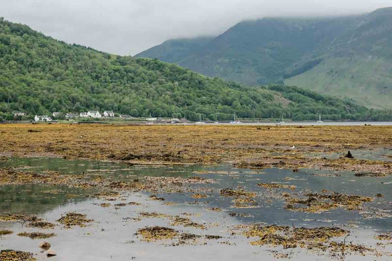 loch leven with houses and mountain in background which is one of the best things to see in glencoe