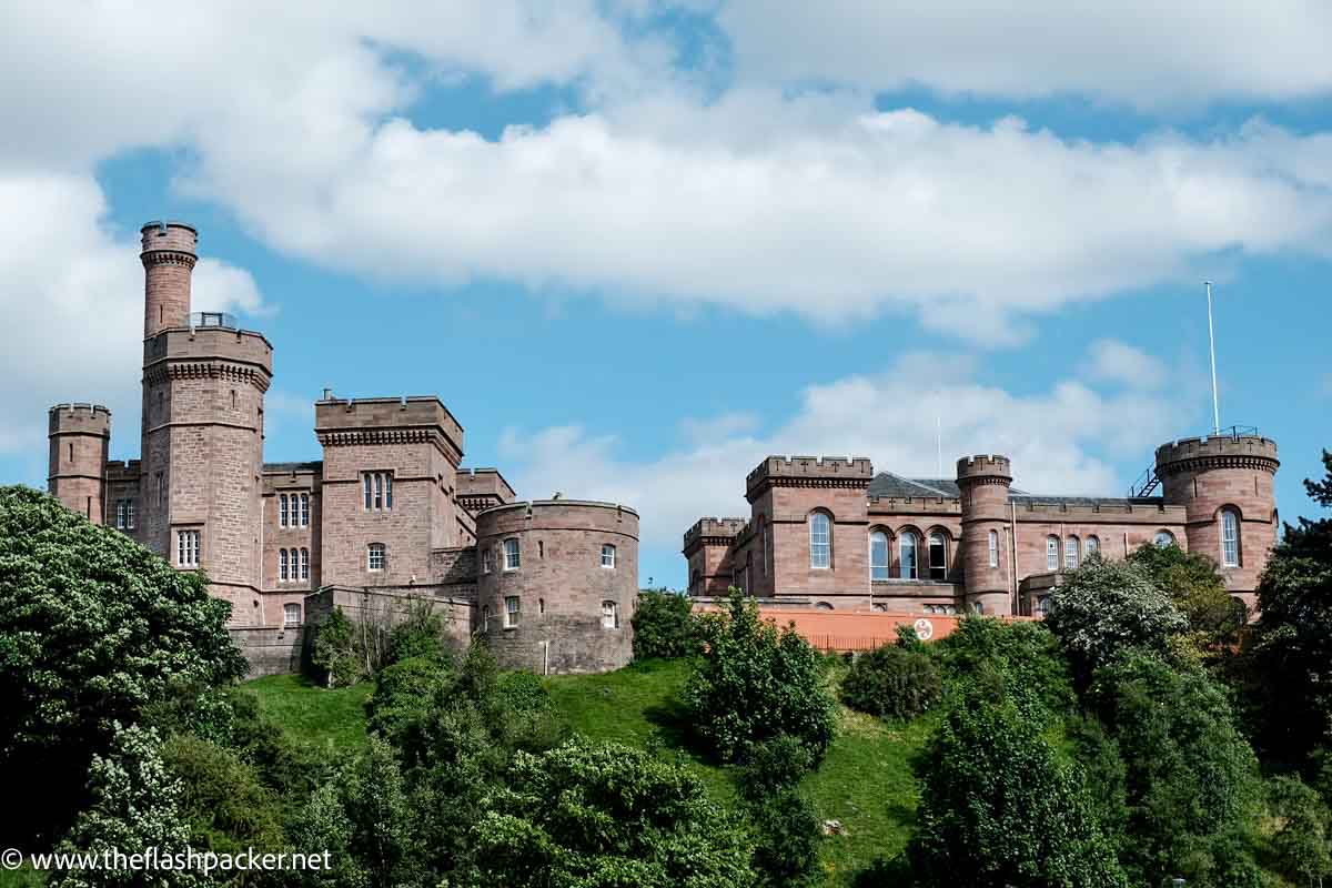 castle made from pink stone on hill seen during 3 days in inverness