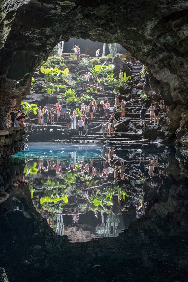 reflecting pool in a cave with lots of people