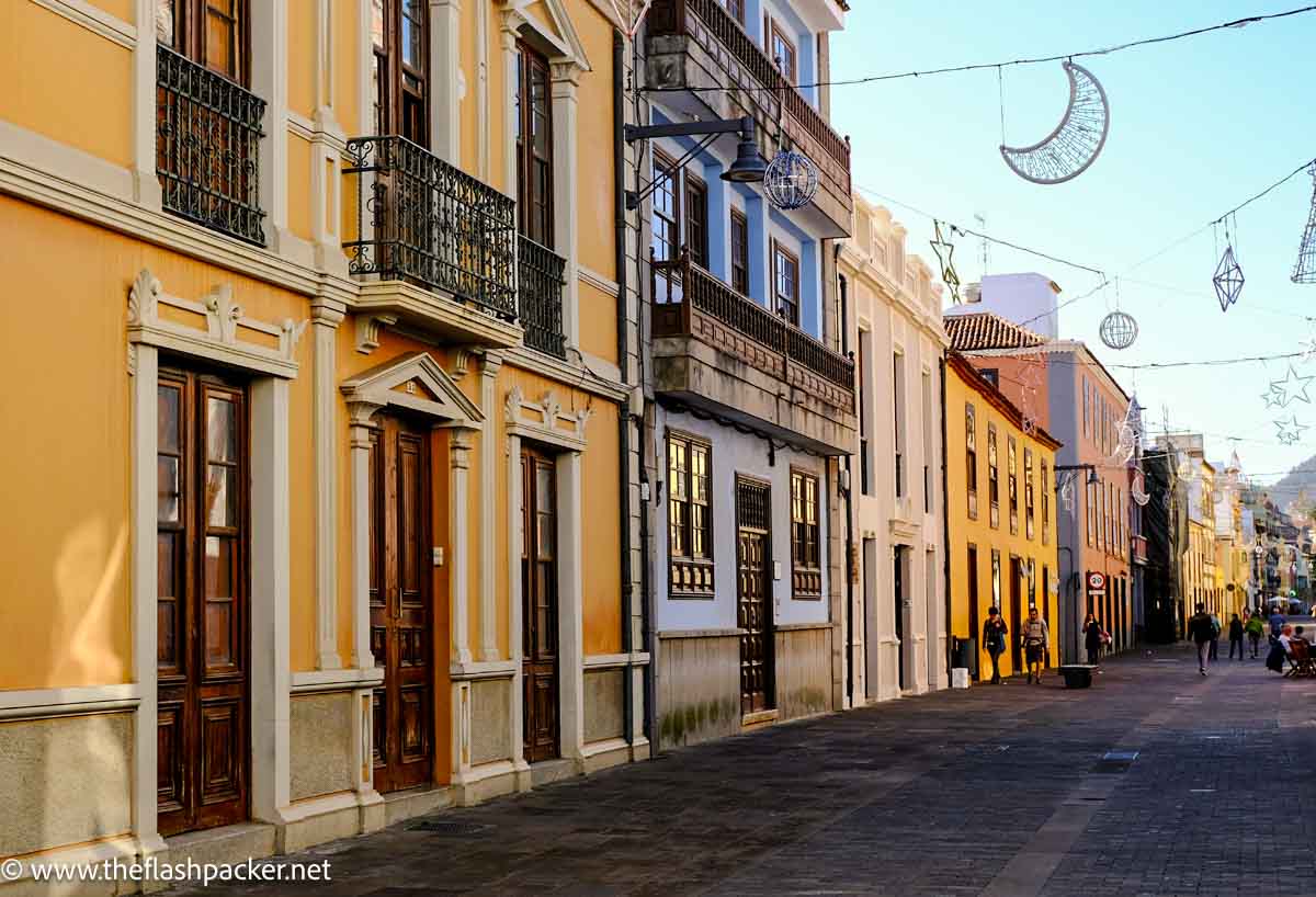 street of ochre and yellow colonial houses with iron balconies in la laguna tenerife