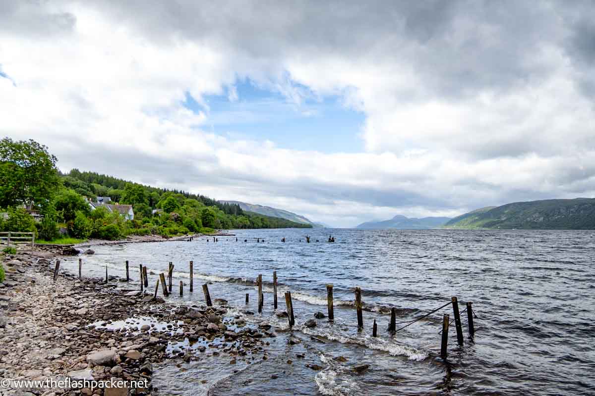 larke lake of loch ness with a line of wooden posts in foreground