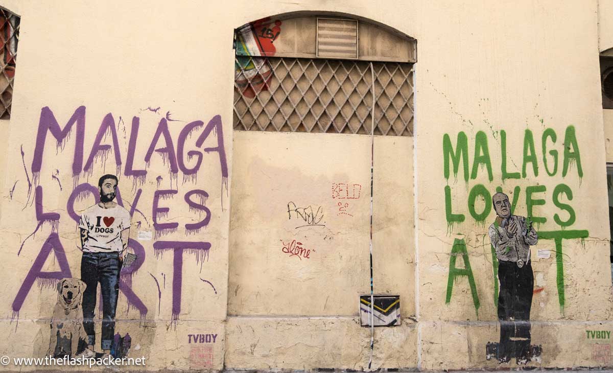 wall mural with pictures of two men and the words malaga loves art