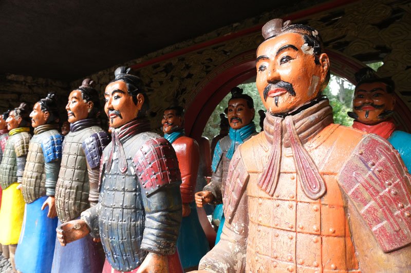 line of brightly painted wooden samurai soldiers