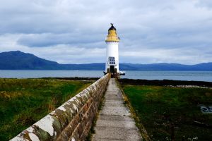 long path leading to a lighthouse on mull scotland