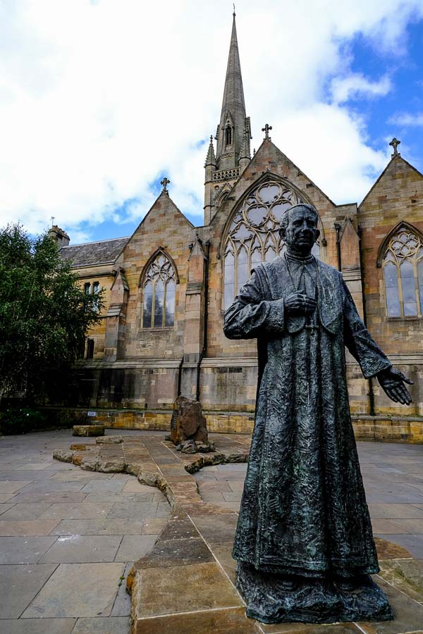 statue of basil hume outside front of st marys cathedral in newcastle