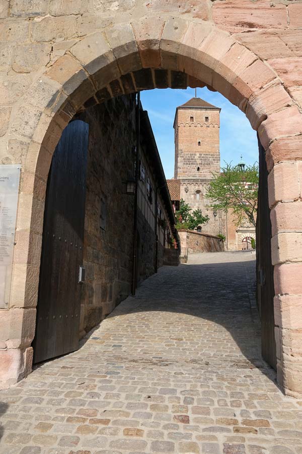 arched gateway leading to castle tower