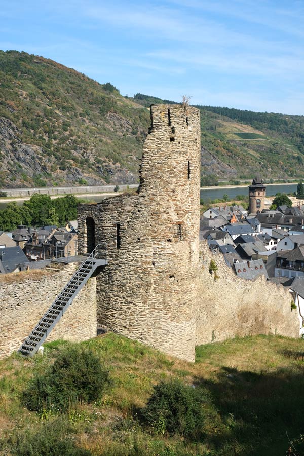 partially destroyed tower that is part of a town wall along the river rhine