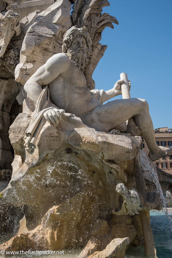 marble sculpture of greek god of fountain in rome