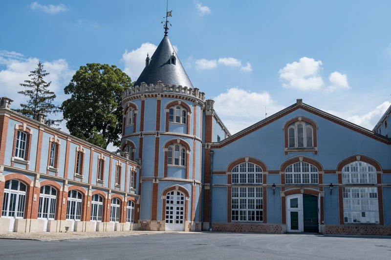 exterior of neo tudor blue building belonging to pommery champagne house of reims france