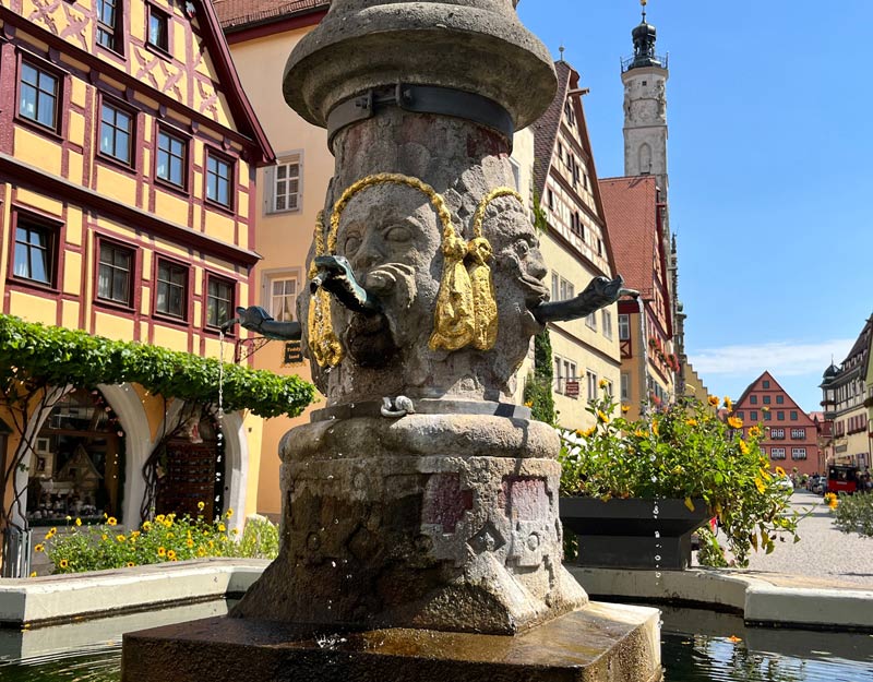 ornate fountain in medieval street