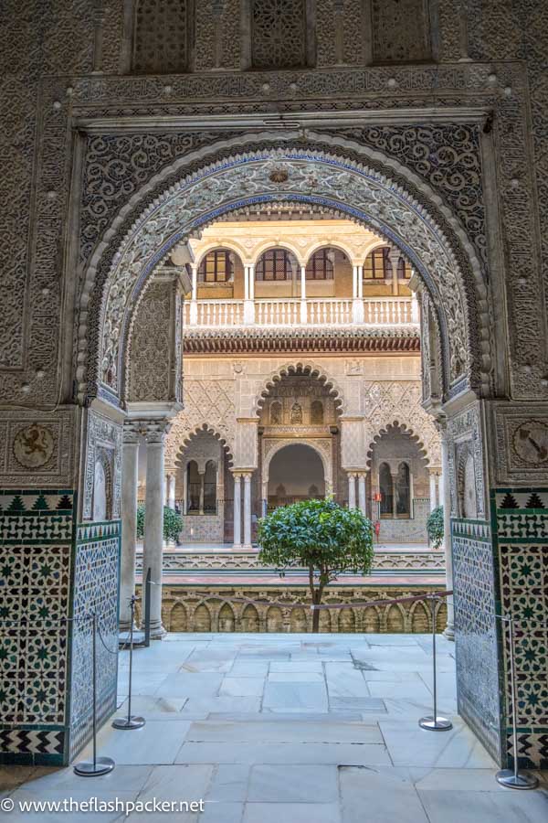 ornate horseshoe arch looking into courtyard