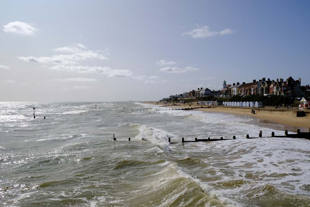 rolling surf beach and houses of southwold suffolf