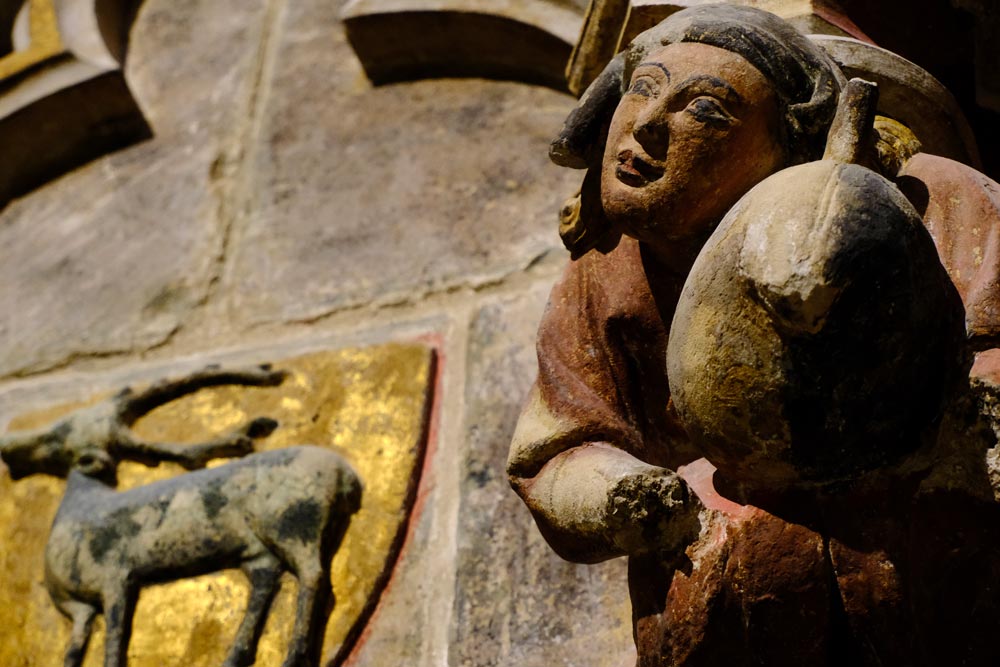 stone carving of angel playing bagpipe