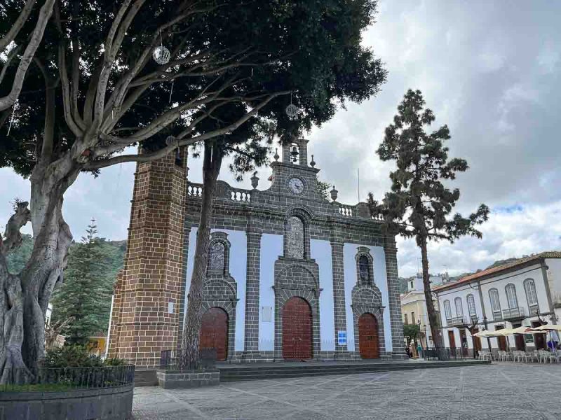 exterior of basilica de nuestra senora de pino in teror gran canaria in a square with a large tree