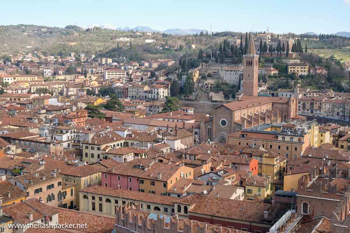 panoramic view of red roofs of verona italy with bell tower of church