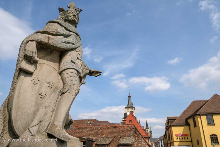 stone statue of a king in armour