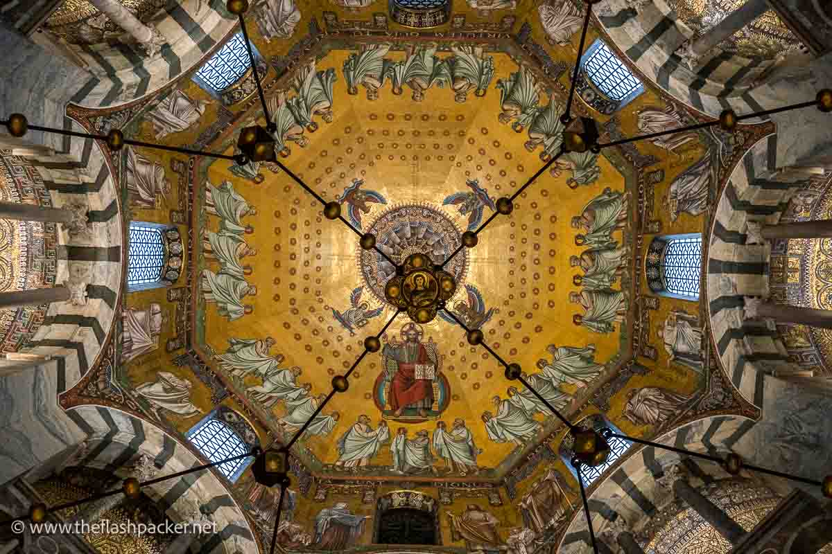 octagonal dome of aachen cathedral with a golden mosaic of christ in judgement surrounded by figures in classical dress