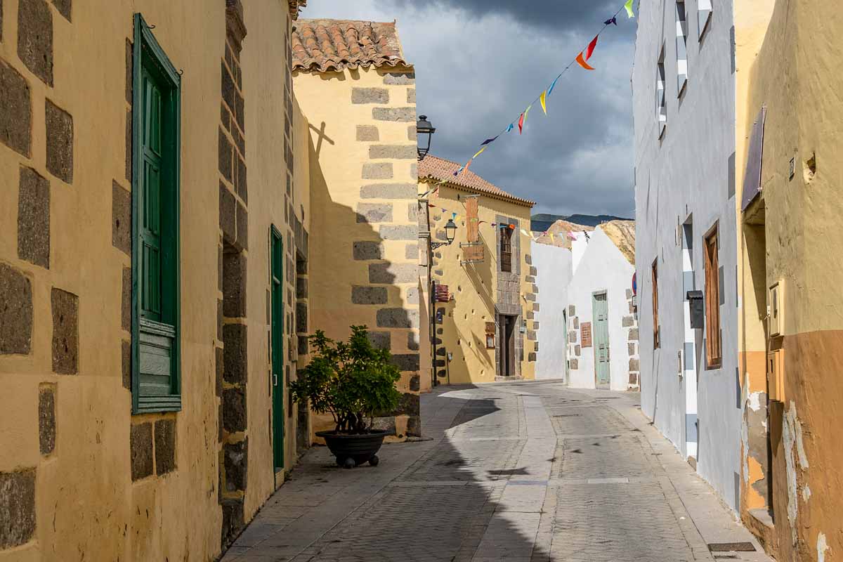 pretty colonial street lined with whitewashed and mustard coloured low stone buildings