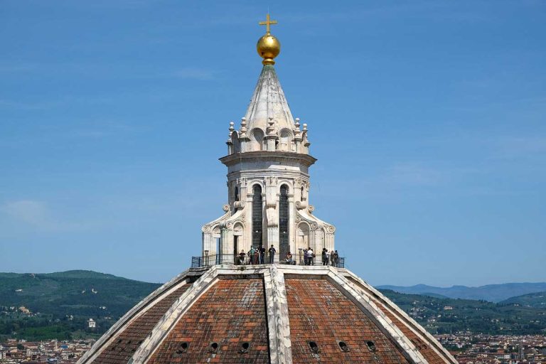 people on walking of the terrace of red dome of cathedral which is one of the famous landmarks in florence