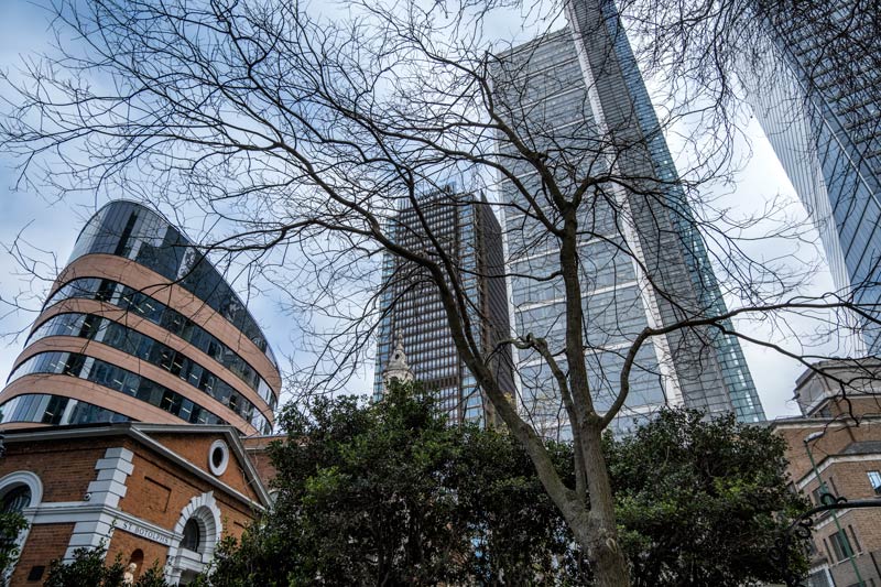 old buildings amongst gleaming new buildings