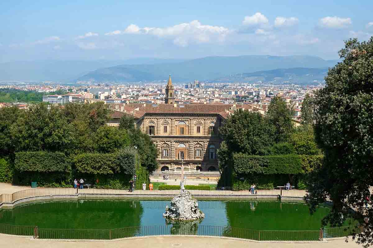 large fountain with pitti palace and skyline of Florence and mountains in background