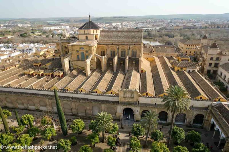 aerial view of the immense mezquita of cordoba and its tree filled courtyrad