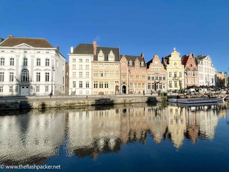 row of medieval houses reflected in the canal of ghent in belgium