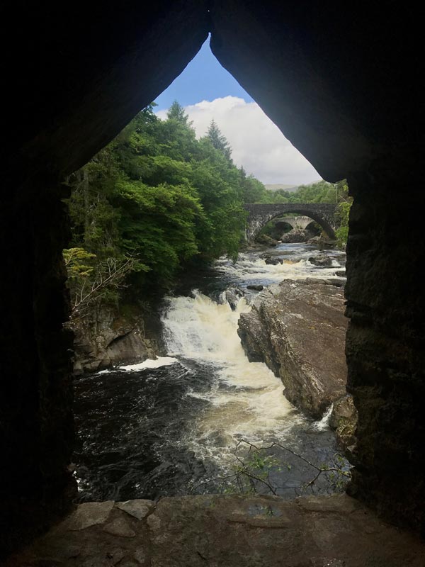 fast flowing river and bridge