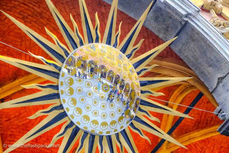 mirrored glass with reflections of colonnaded market in Veille Bourse, Lille