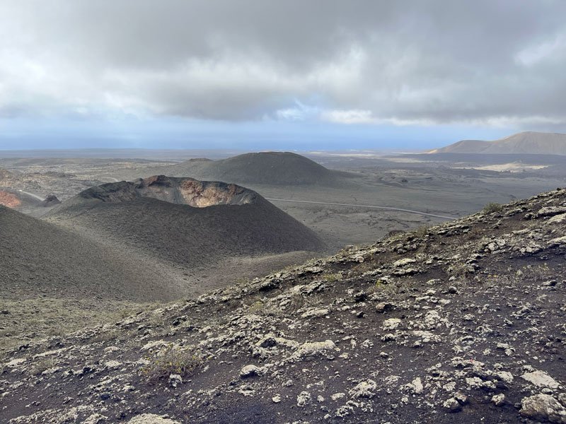 volcanic landscape of lanzarote with extinct volcano crater