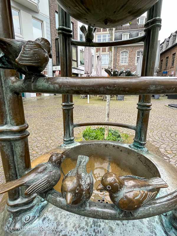 fountain with bronze figures of sparrows