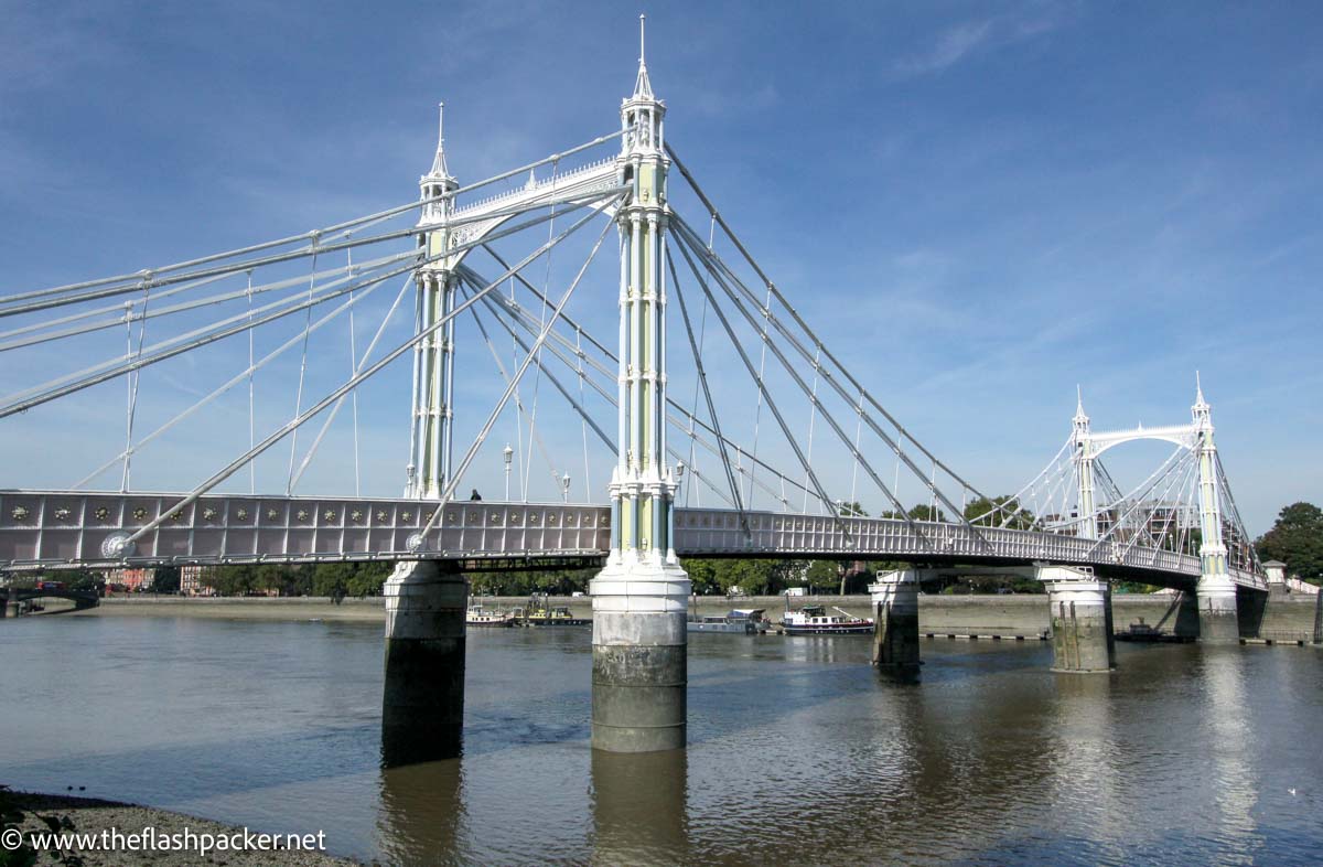 pretty white suspension bridge over river in london