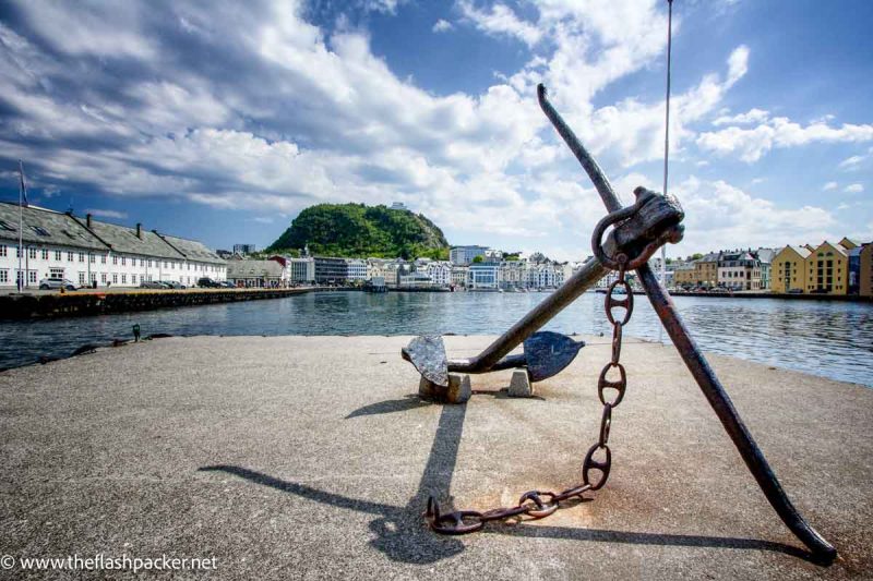 anchor in foreground of fishing harbour