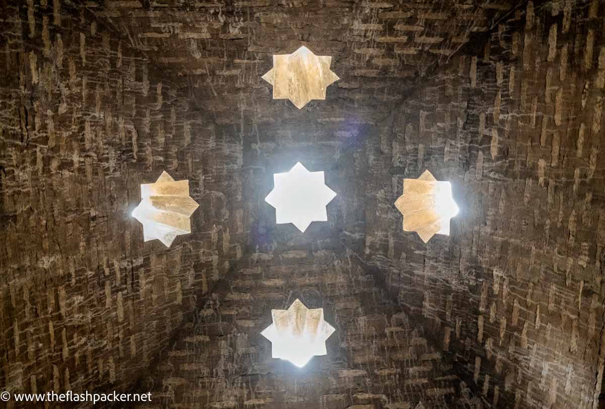 star shaped skypights in old baths at the alhambra palace in granada