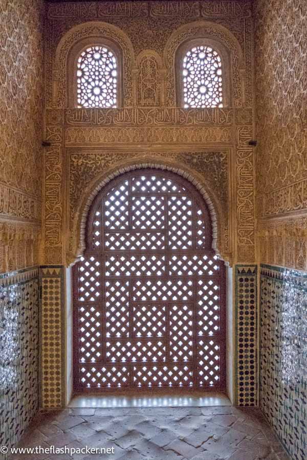 latticed door and 2 windows