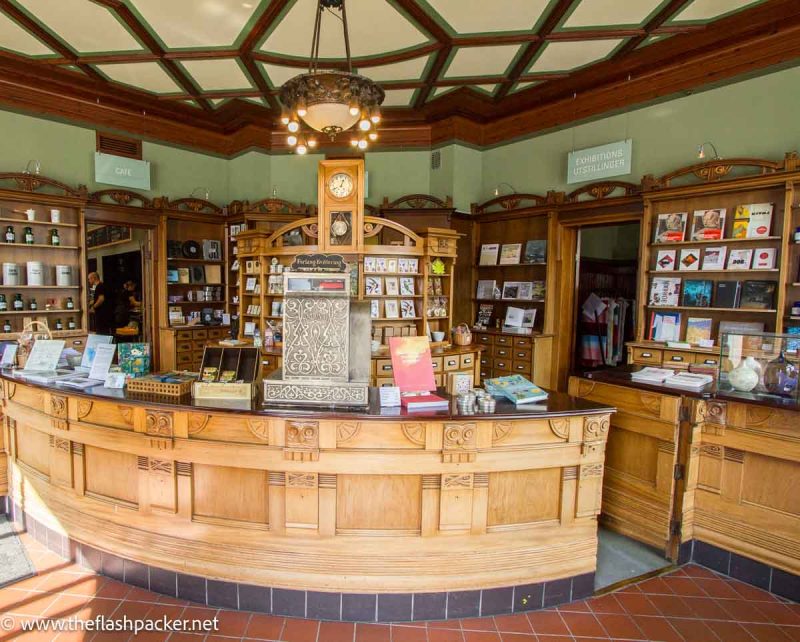 interior of old chemist shop with wooden counter