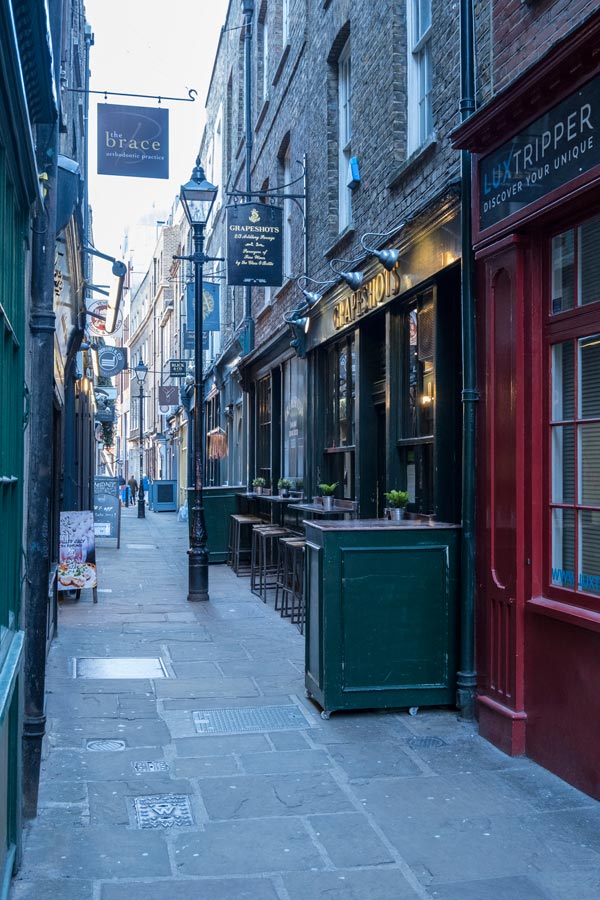 narrow passageway lined with old shops