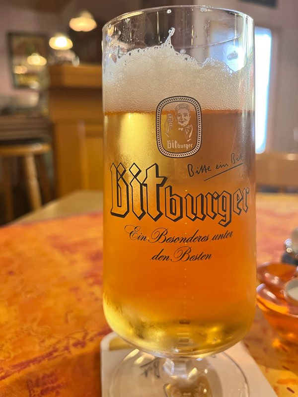 amber beer in a bitburger glass