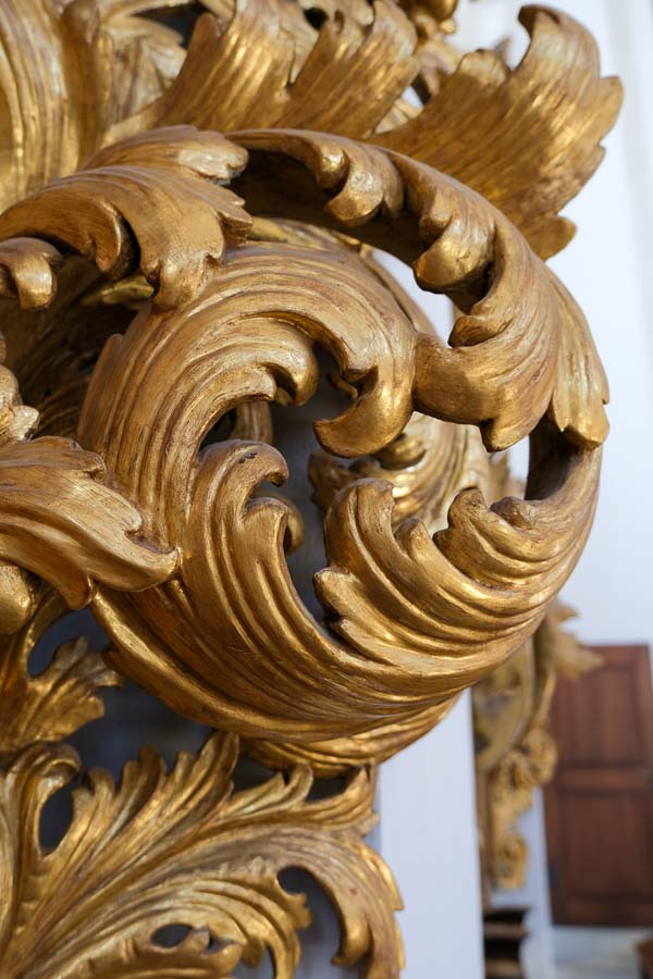 detail of carved wooden choir stall in church