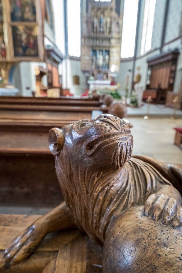 wooden sculpture of a lion on a pew in the basilica in bardejov slovakia